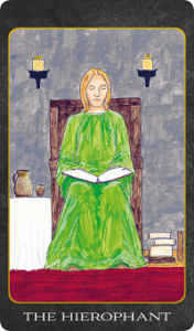 The Hierophant tarot card featuring a robed figure seated in a stone chamber holding an open book beneath candlelight.